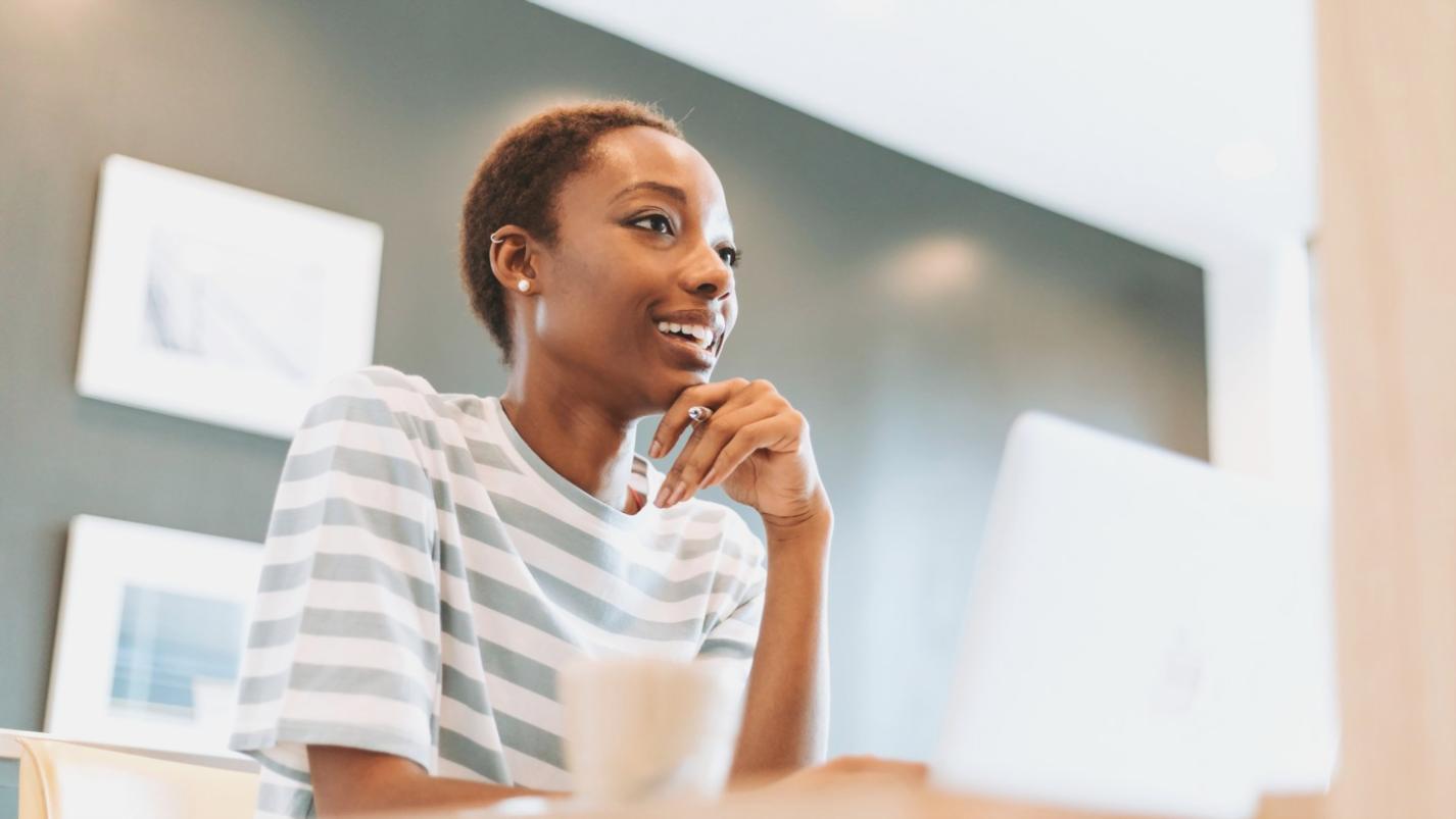 Person reviewing financial documents with confidence